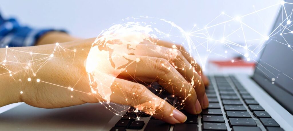 Typing on a laptop computer using KI tools